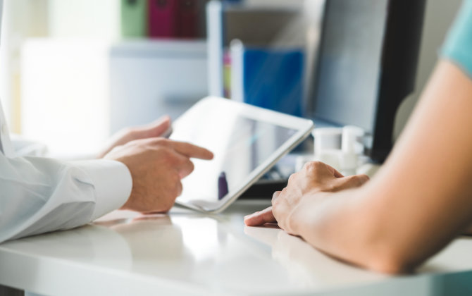 Dentist revising electronic health records