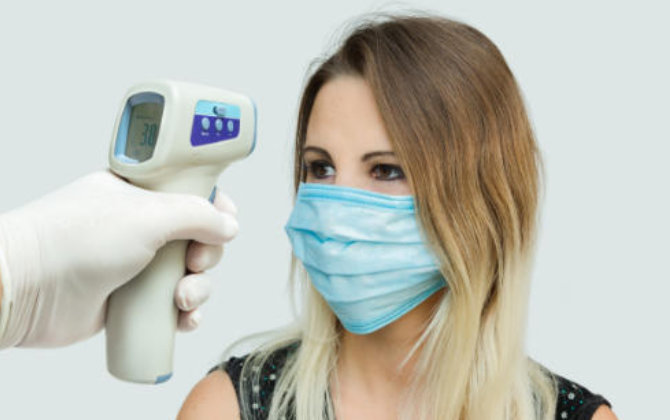 temperature check before dental appointment at Riverwood Dental Atlanta, GA